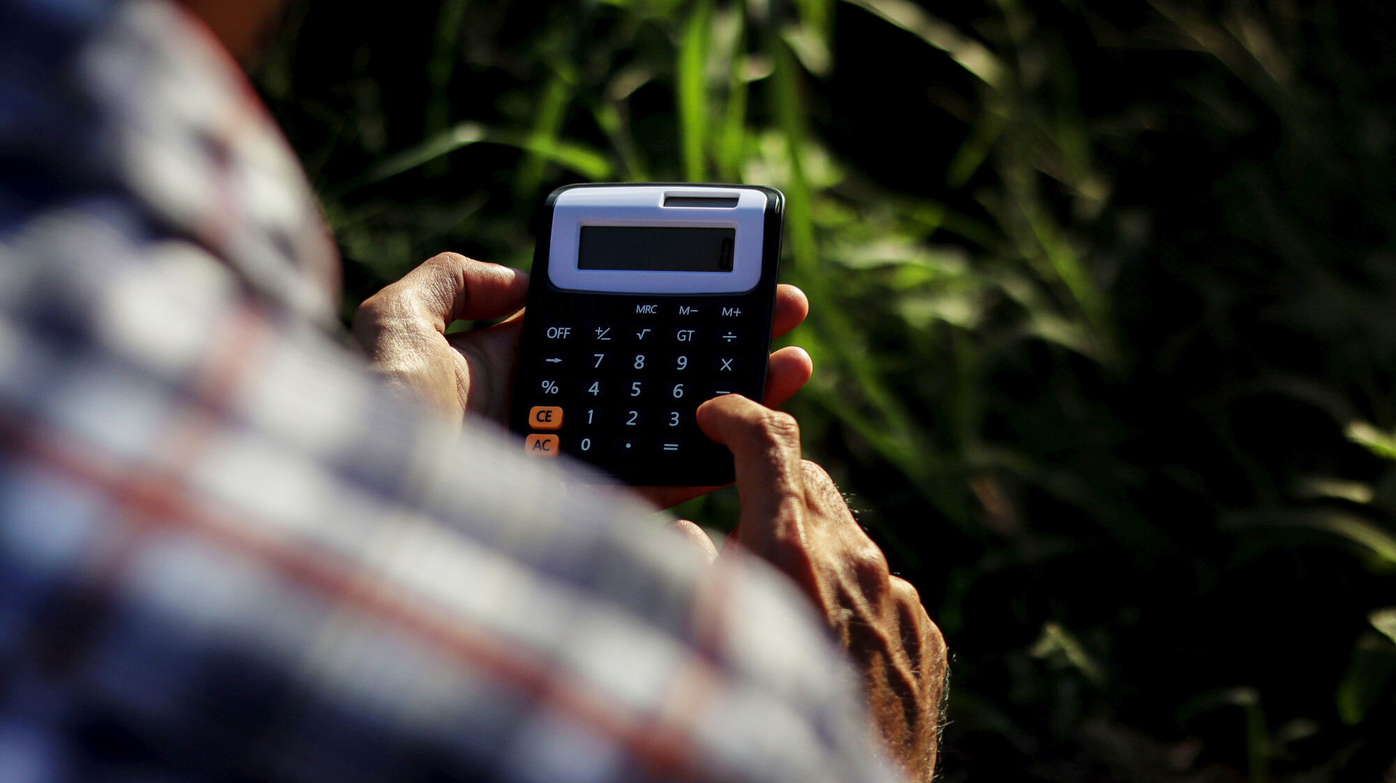 Farmer with Calculator